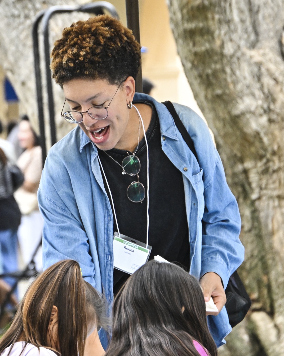 Renna Carver volunteering with students at an outdoor event